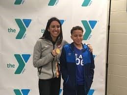 Janet Evans with her gold medal at local YMCA