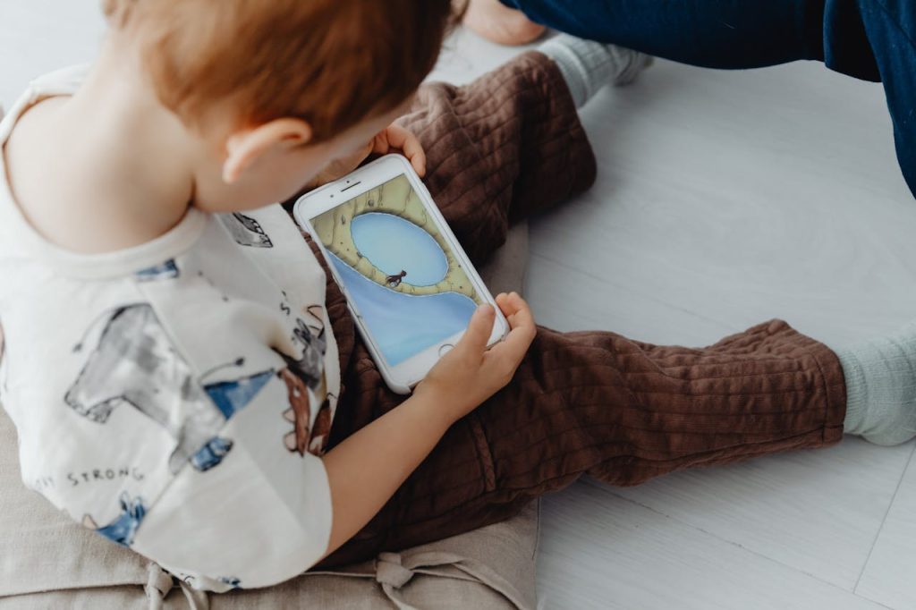 toddler on cell phone playing games misunderstanding causes sexual abuse allegations